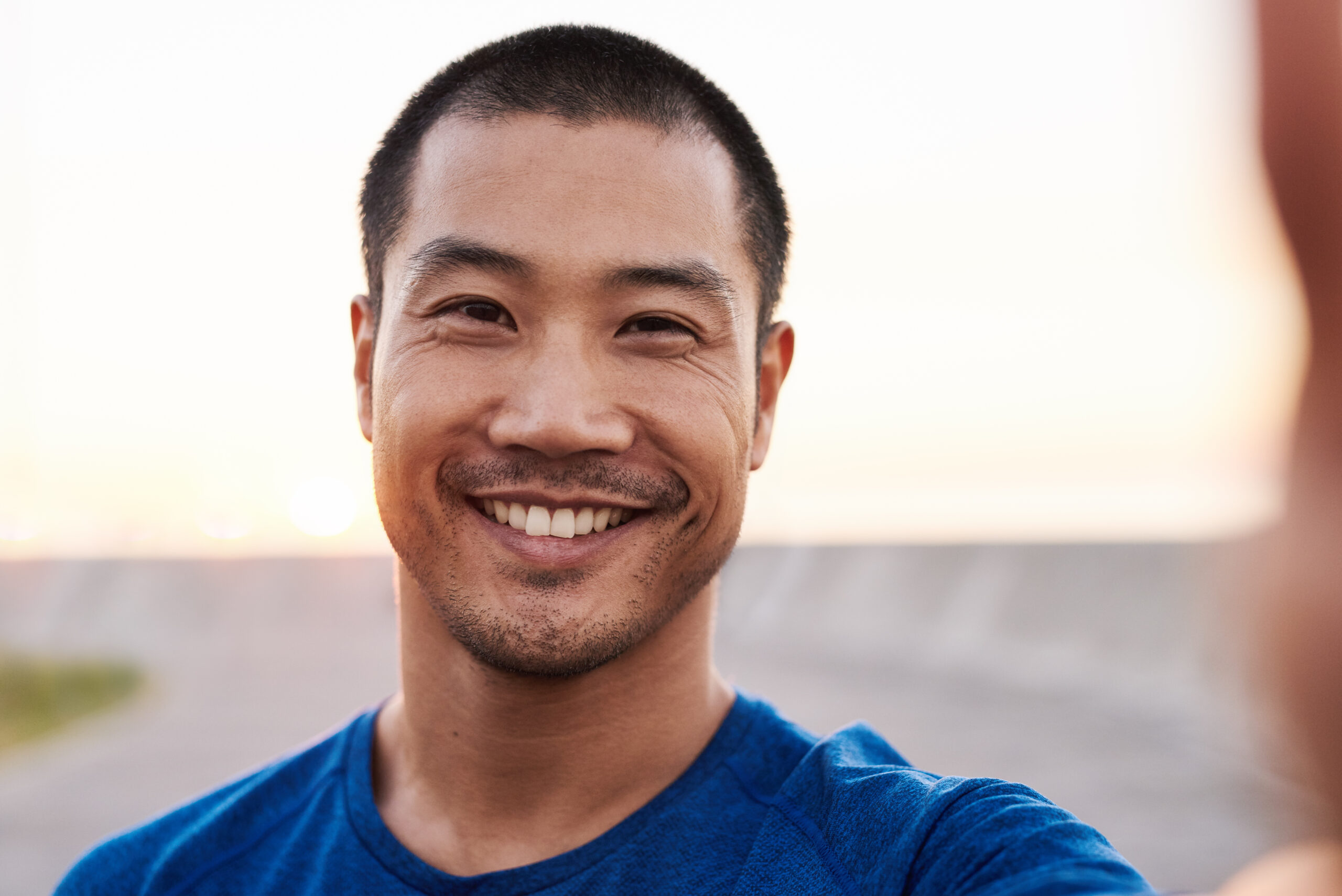 Athletic man outside taking a selfie